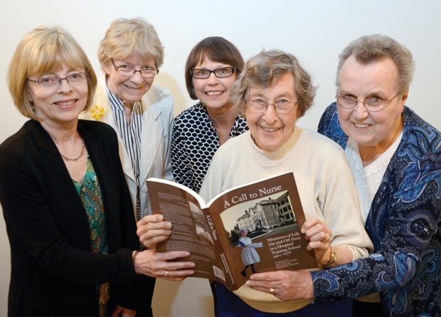 Group of nurses with book